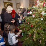 The Duchess of Cornwall decorates the Clarence House Christmas tree with the help of children supported by Helen & Douglas House and The London Taxi Drivers’ Fund for Underprivileged Children, 2015.