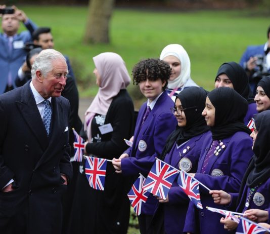 The King and Queen Meet London Communities The Prince of Wales is greeted by local school children during a visit to the British Muslim Heritage Centre in Manchester, where he met members of the Muslim community and learned about the centre's programme of education and community initiatives, 2019.