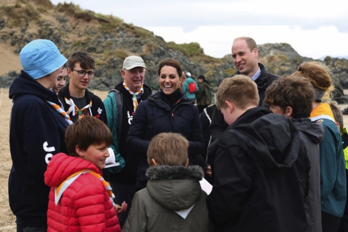 The Duke and Duchess of Cambridge explore the wildlife habitat on Newborough Beach in North Wales with members of Menai Bridge Scouts, 2019