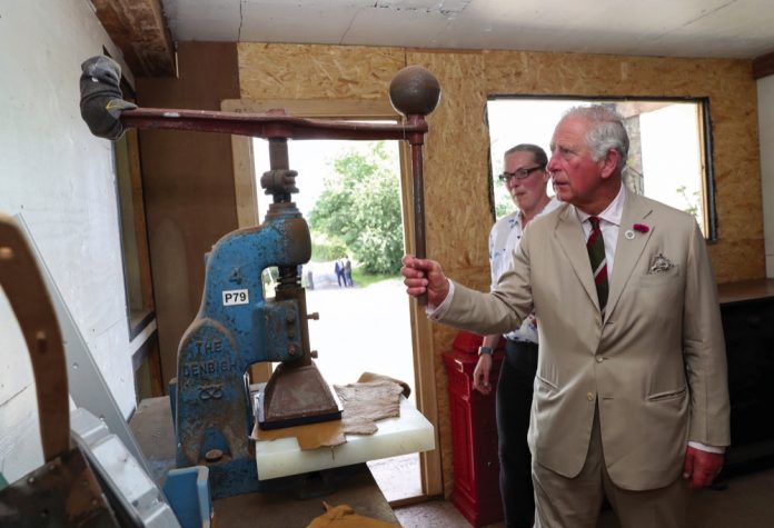 The Prince of Wales, Patron for The Prince's Countryside Fund, visits bag maker Hayley Hanson, who creates sustainable leather bags and goods, and whose company has benefited from The Princes Countryside Fund Farm Resilience Programme, during a visit to Brecon in Wales, 2019.