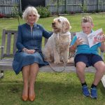 The Duchess of Cornwall with therapy dog, Meg, and Liam Curtis at Kerikeri Primary School, the Bay of Islands, New Zealand