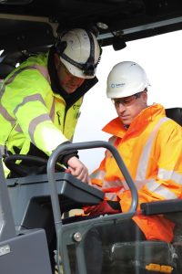 The Duke of Cambridge (right) operating an asphalt paver during a visit to the Tarmac National Skills and Safety Park in Nottinghamshire.