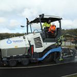 The Duke of Cambridge (seated in cab) operating an asphalt paver during a visit to the Tarmac National Skills and Safety Park in Nottinghamshire.