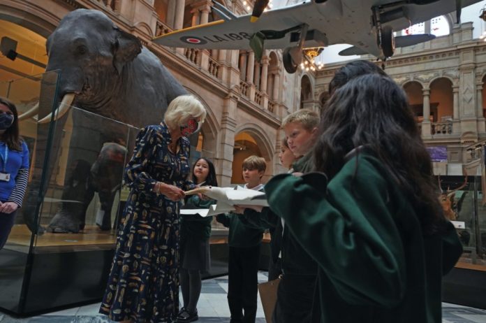 The Duchess of Cornwall talks to school children as they hold a model of an albatross during a visit to Kelvingrove Art Gallery and Museum in Glasgow to celebrate its 120th anniversary, September, 2021.