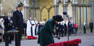 Queen Camilla Cancels Scheduled Engagement The Duchess of Cornwall places a memorial cross during a service to remember the war dead on Armistice Day at the 93rd Field of Remembrance at Westminster Abbey in London, which has been held in the grounds of the abbey since November 1928. November 11, 2021.