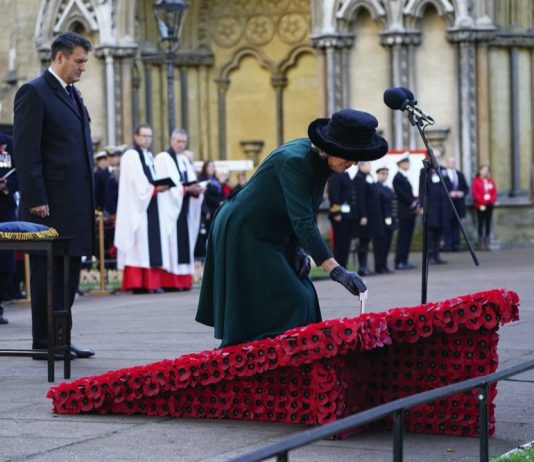 Queen Camilla Cancels Scheduled Engagement The Duchess of Cornwall places a memorial cross during a service to remember the war dead on Armistice Day at the 93rd Field of Remembrance at Westminster Abbey in London, which has been held in the grounds of the abbey since November 1928. November 11, 2021.