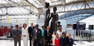 The Prince and Princess of Wales Celebrate Black History Month The Duke and Duchess of Cambridge, accompanied by Baroness Floella Benjamin, Windrush passengers Alford Gardner and John Richards and children at the unveiling of the National Windrush Monument at Waterloo Station, to mark Windrush Day. The statue - of a man, woman and child in their Sunday best standing on top of suitcases - was designed by the Jamaican artist and sculptor Basil Watson. June 2022.