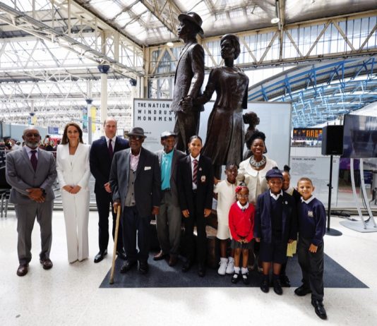 The Prince and Princess of Wales Celebrate Black History Month The Duke and Duchess of Cambridge, accompanied by Baroness Floella Benjamin, Windrush passengers Alford Gardner and John Richards and children at the unveiling of the National Windrush Monument at Waterloo Station, to mark Windrush Day. The statue - of a man, woman and child in their Sunday best standing on top of suitcases - was designed by the Jamaican artist and sculptor Basil Watson. June 2022.