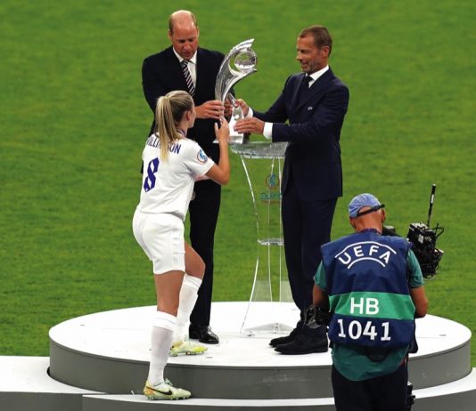 The Prince of Wales to Visit England Men’s Football Team Ahead of EURO 2024 The Duke of Cambridge and UEFA president Aleksander Ceferin pass the trophy to England's Leah Williamson after winning the UEFA Women's Euro 2022 final at Wembley Stadium, London. July 31, 2022.