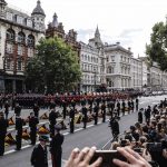 The coffin of Britain Queen Elizabeth is carried on a gun carriage pulled by Royal Navy service personnel during the funeral procession on their Winterhall street on the day of the state funeral and burial of Britain Queen Elizabeth, in London, Britain, S