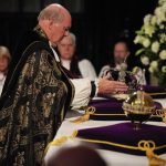 The Dean of Windsor, The Rt Revd David Conner, places the Imperal State Crown, and orb and sceptre on the high altar during the Committal Service for Queen Elizabeth, at St George’s Chapel in Windsor Castle, Berkshire. Picture date: Monday September 19, 2