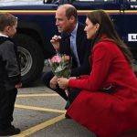 The Prince of Wales (centre) gestures as his wife the Princess of Wales is presented with a posy of flowers by four-year-old Theo Crompton, during their visit to the RNLI Holyhead Lifeboat Station in Anglesey, north Wales, where they met with crew, volunt