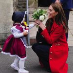 The Princess of Wales receives a posy of flowers from Charlotte Bunting, aged two, as she leaves after a visit to St Thomas Church, in Swansea, Wales. Picture date: Tuesday September 27, 2022.