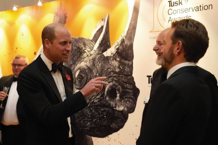 The Prince of Wales speaks with guests during the 10th annual Tusk Conservation Awards at Hampton Court Palace, London, November 1, 2022.