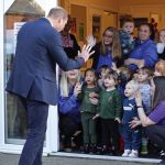 The Prince of Wales waves to children as he leaves the Rainbow Centre, an organisation that offers an open door to the community of Scarborough, North Yorkshire, and help and support to anyone in need, as part of his visit to the area to launch funding to