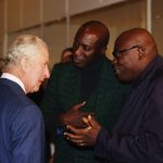 King Charles III speaks to fashion designer Ozwald Boateng, OBE (left) and Edward Kobina Enninful OBE, editor-in-chief of British Vogue (right) during his visit to the Africa Fashion exhibition at the Victoria and Albert Museum, London. November 3, 2022.