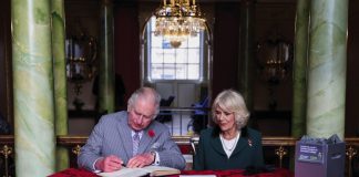 The Queen Consort to Host a ‘Violence against Women and Girls’ Reception King Charles III and the Queen Consort sign the visitors book as they arrive for a ceremony at Mansion House to confer city status on Doncaster, November 9, 2022.