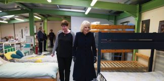 The Queen will Visit STORM Family Centre The Queen Consort is given a tour by the Head of Business Rachael Burton during a visit to Emmaus Community at Bobby Vincent House in West Norwood, December 13, 2022.