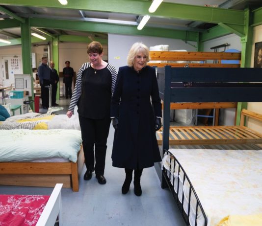 The Queen will Visit STORM Family Centre The Queen Consort is given a tour by the Head of Business Rachael Burton during a visit to Emmaus Community at Bobby Vincent House in West Norwood, December 13, 2022.