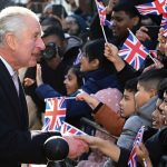 Britain’s King Charles III with Camilla, the Queen Consort visit Brick Lane in east London, Wednesday Feb. 8, 2023, to meet with charities and businesses. (Eddie Mulholland/Pool via AP)