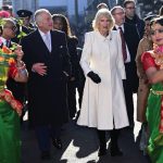 Britain’s King Charles III and Camilla, the Queen Consort visit Brick Lane in east London, Wednesday Feb. 8, 2023, to meet with charities and businesses. (Eddie Mulholland/Pool via AP)