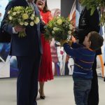 Britain’s King Charles III receives flowers from a young boy as he visits the University of East London to mark the University’s 125th anniversary and open a new frontline medical teaching hub in London, Wednesday, Feb. 8, 2023. (AP Photo/Frank Augstein,