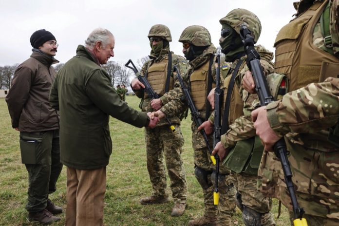 King Charles III meets with Ukrainian recruits being trained by British and international partner forces in Wilthshire, England, Feb. 20, 2023.