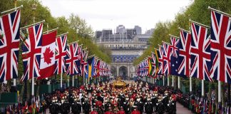 The King, accompanied by The Princess Royal, will present a new Sovereign’s Standard to The Blues and Royals The Coronation Procession travels along The Mall following the Coronation of King Charles III and Queen Camilla in London, 2023