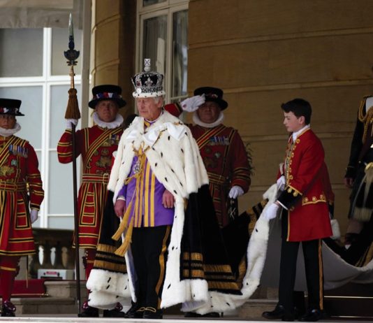 The King and Queen to Host Their Military Affiliations King Charles III receives a royal salute from members of the military in the gardens of Buckingham Place, London, following the coronation. May 6, 2023.