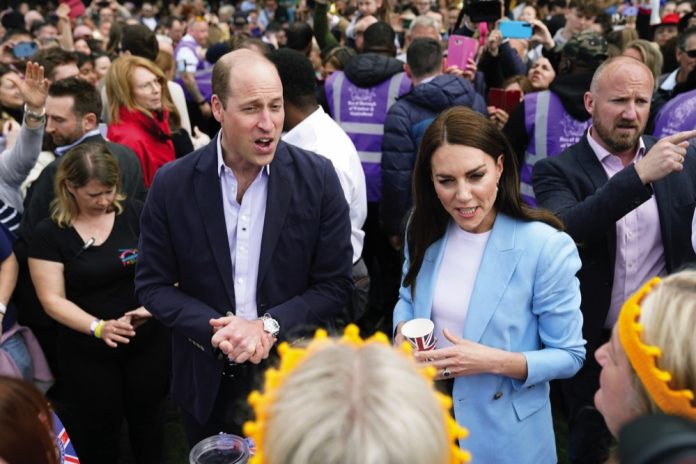 The Prince and Princess of Wales speak to members of the public, during a walkabout on the Long Walk near Windsor Castle where the Coronation Concert to celebrate the coronation of King Charles III and Queen Camilla is being held, in Windsor, England, May 2023.