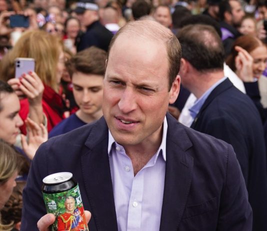 The Prince of Wales joins American Football Stars at NFL Foundation UK Event Prince William is given a can of 'Return of the King' Coronation Ale, during a walkabout on the Long Walk near Windsor Castle, Sunday May 7, 2023.