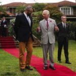 Britain’s King Charles III speaks to British Foreign Secretary James Cleverly, left, as British High Commissioner to Kenya Neil Wigan looks on , during a reception at the British High Commissioner’s Residence in Nairobi, Kenya, Wednesday, Nov. 1, 2023. (T