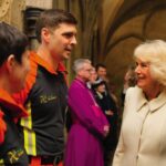 Queen Camilla speaks to members of the Wiltshire Air Ambulance as she arrives to attend a musical evening at Salisbury Cathedral in Wiltshire, to celebrate the work of local charities including the Wiltshire Bobby Van Trust, Wiltshire Air Ambulance, and C