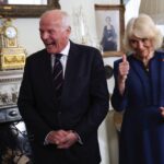 President of The Poppy Factory Surgeon Rear Admiral Lionel Jarvis with Queen Camilla during a celebration at Clarence House, central London, marking the centenary of The Poppy Factory, which was founded in the aftermath of the First World War. The recepti