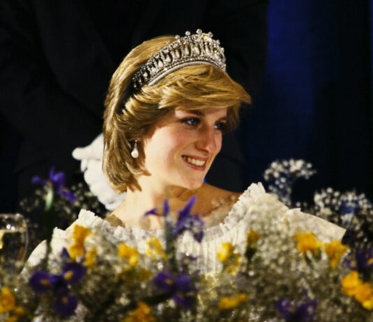 Princess Diana’s Life and Legacy Unveiled through Iconic Photos Diana, Princess of Wales, wearing a cream satin dress by Gina Fratini and wearing the Queen Mary Tiara, attends a banquet at the Hotel Nova Scotia on June 15, 1983 in Nova Scotia, Canada (credit Anwar Hussein)